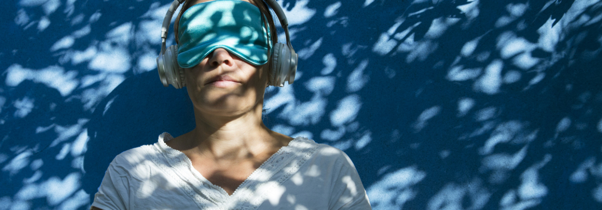 woman with sleep mask headphones ketamine experience
