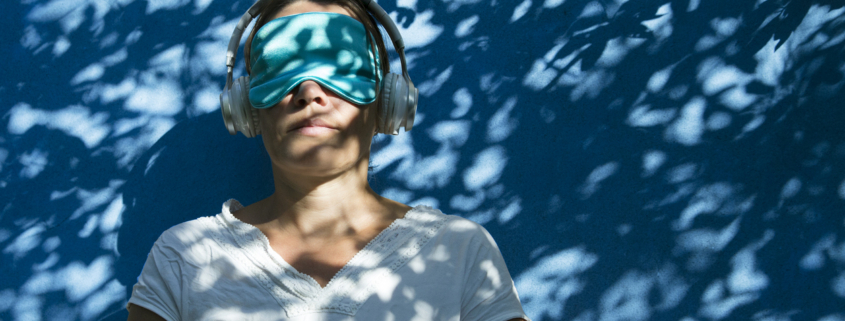 woman with sleep mask headphones ketamine experience